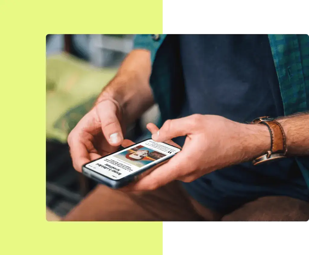 A person using their smartphone to access digital content, exemplifying the ease of reaching subscribers through customized content delivery services.