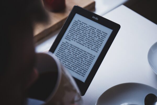 person reading on their kindle