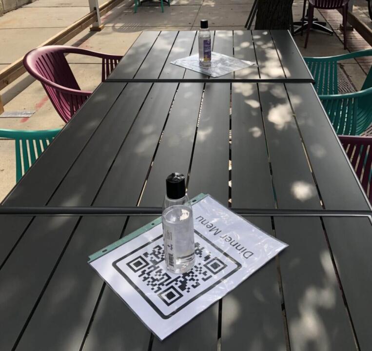 QR code laminated sheets lay on restaurant table
