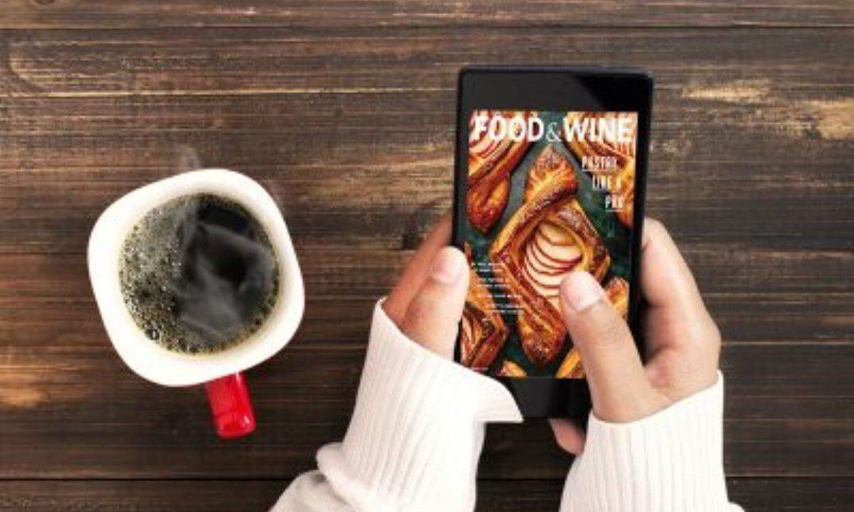 eMags Rewards digital magazine displayed on an iPhone with warm coffee and girl in cozy sweater